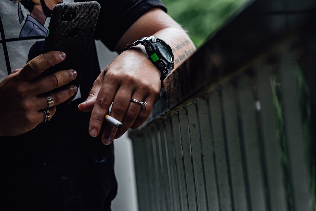 Person using smartphone outdoors