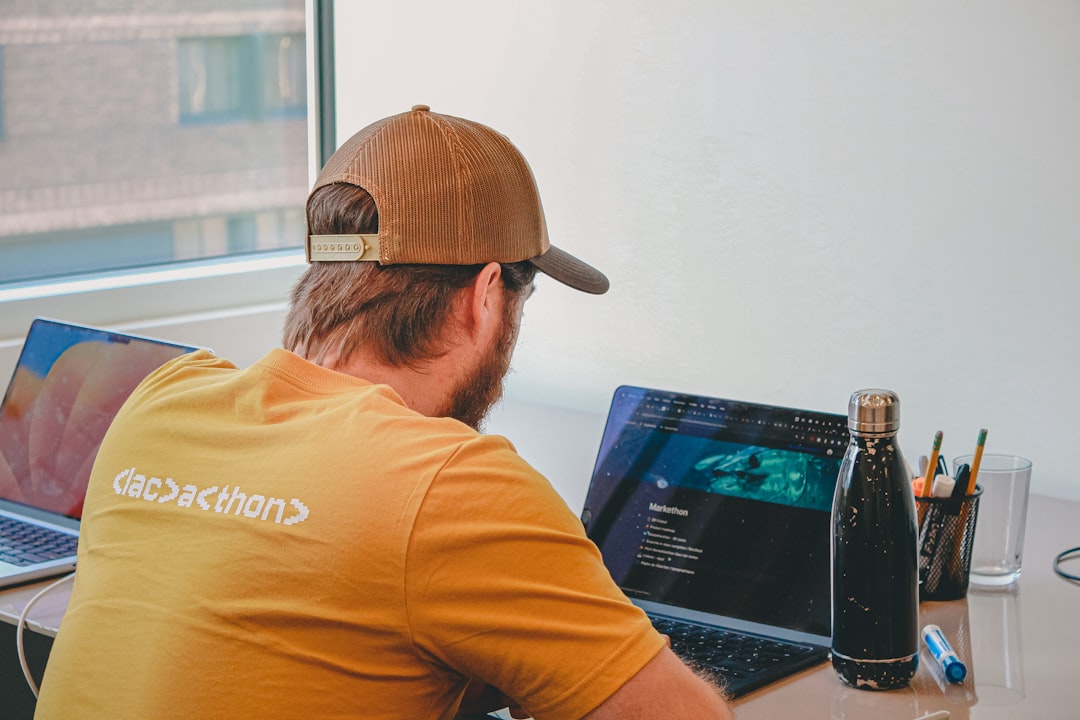 Man coding on laptops
